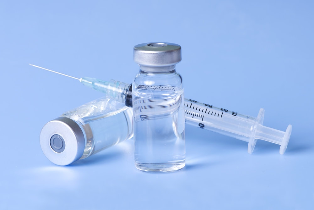 Image of medication vial and injection syringe